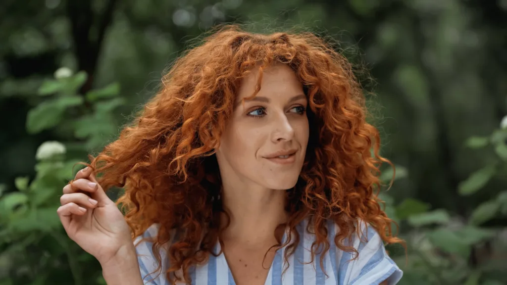 beautiful woman with fine, red curls