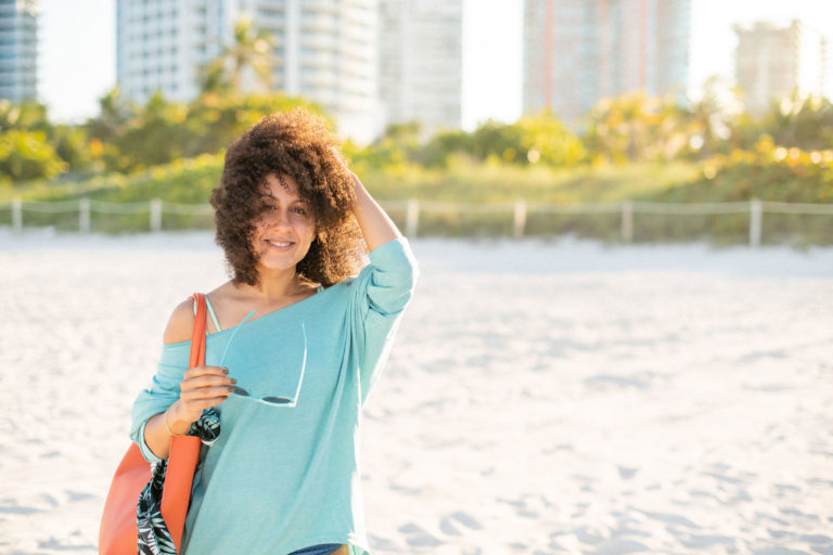 Fine curly hair woman on beach