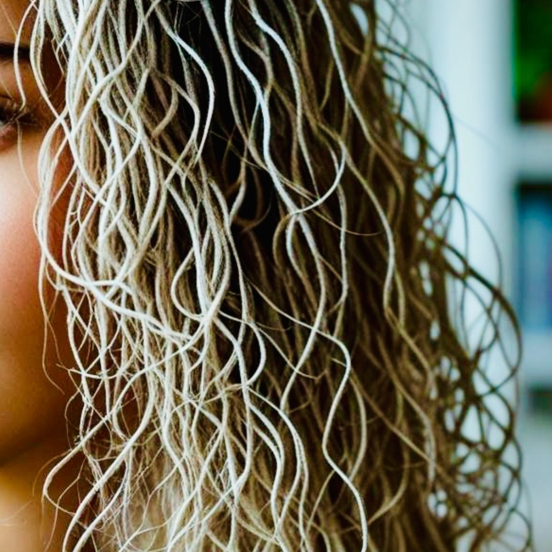 Image of woman with stringy fine curly hair